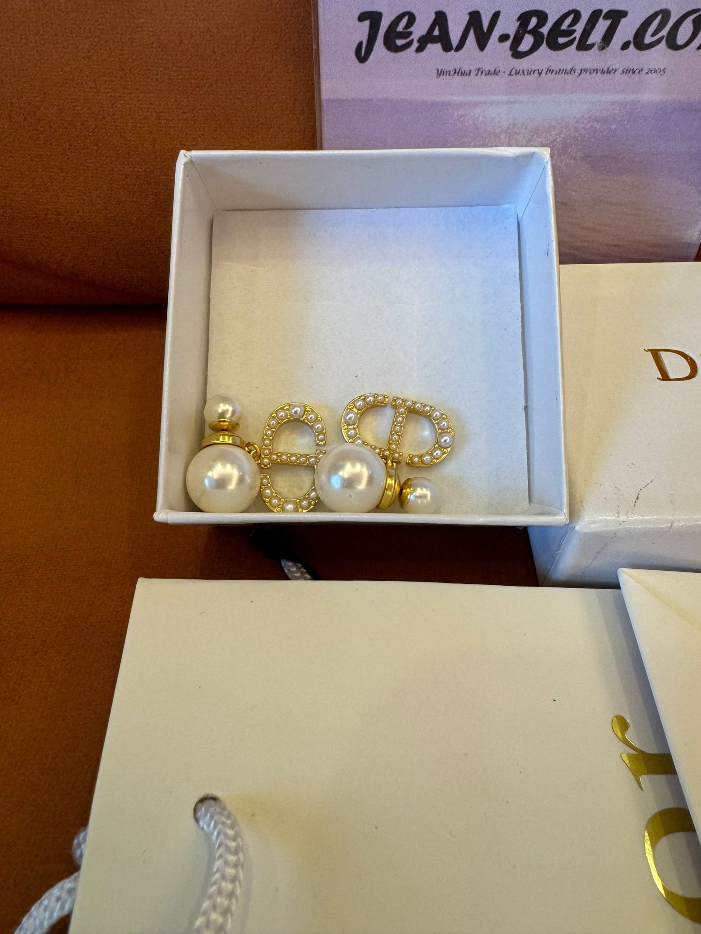 Dior Tribales earrings with pearl and CD logo design