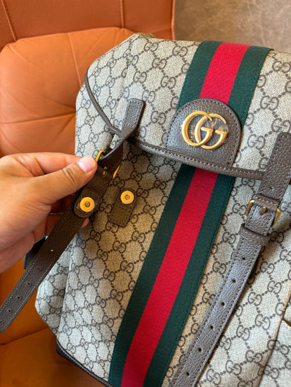 Gucci GG Supreme canvas backpack with web stripe and double buckle design