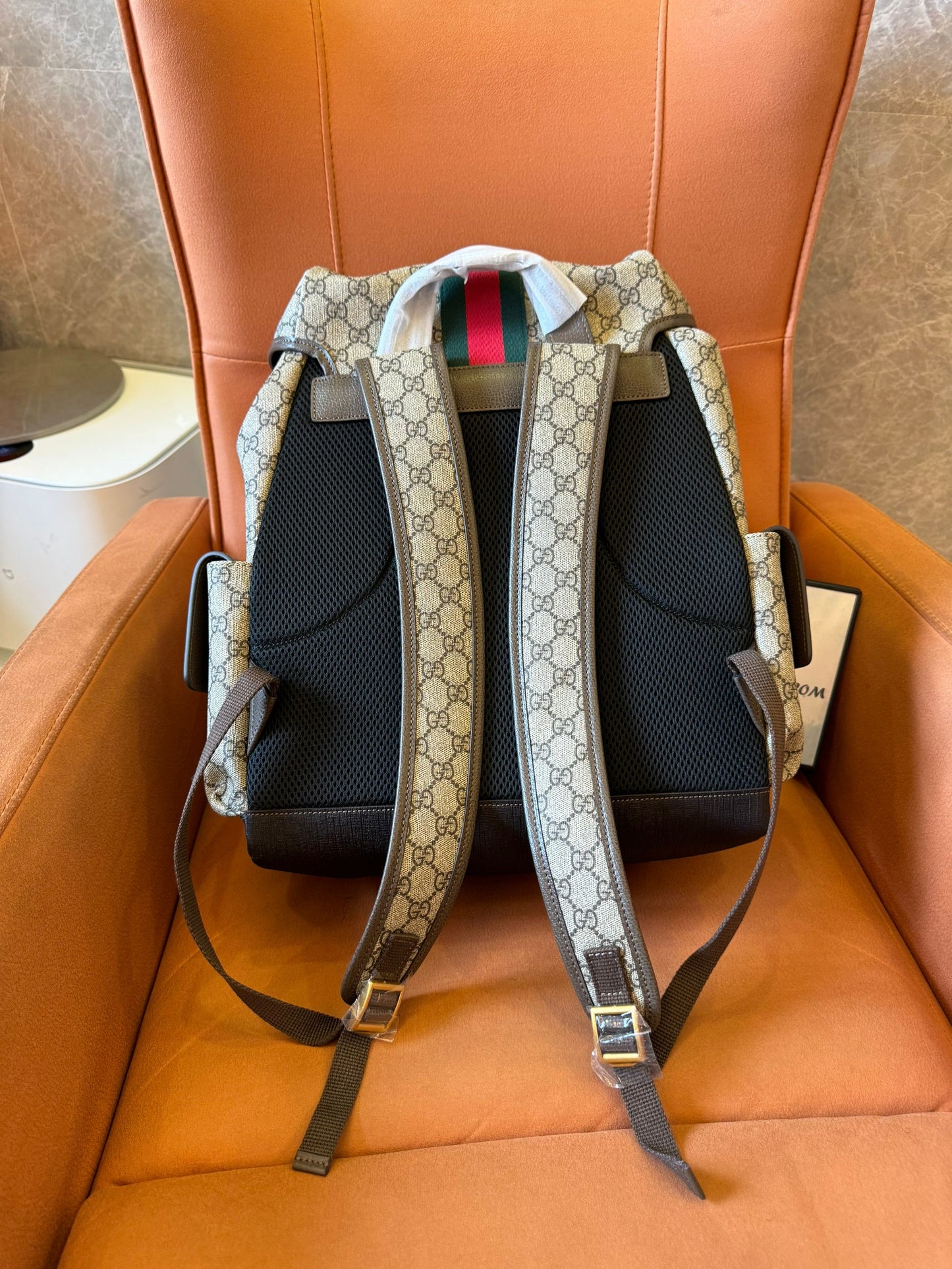 Gucci GG Supreme canvas backpack with web stripe and double buckle design