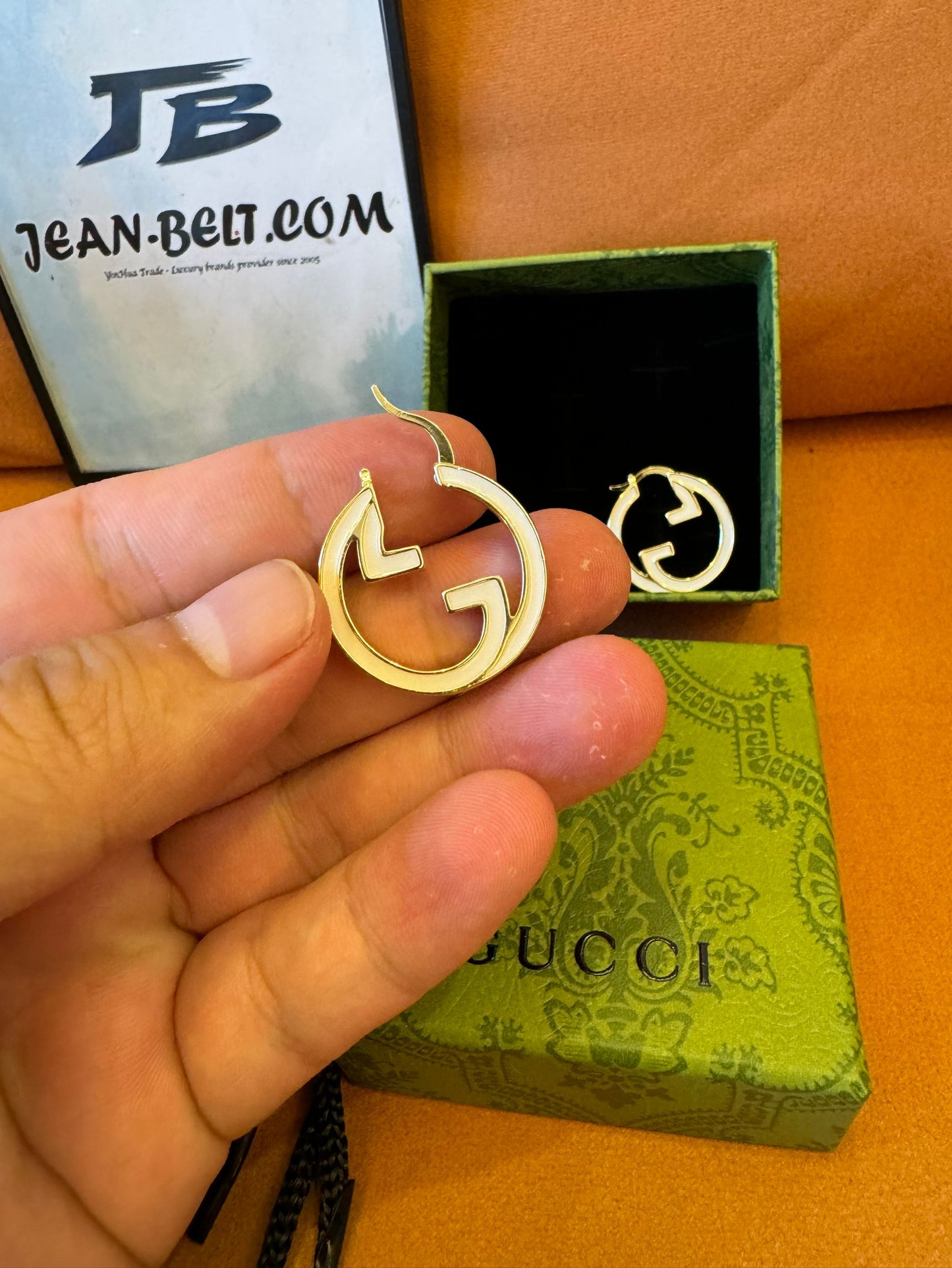 Gucci GG logo hoop earrings in gold-tone metal