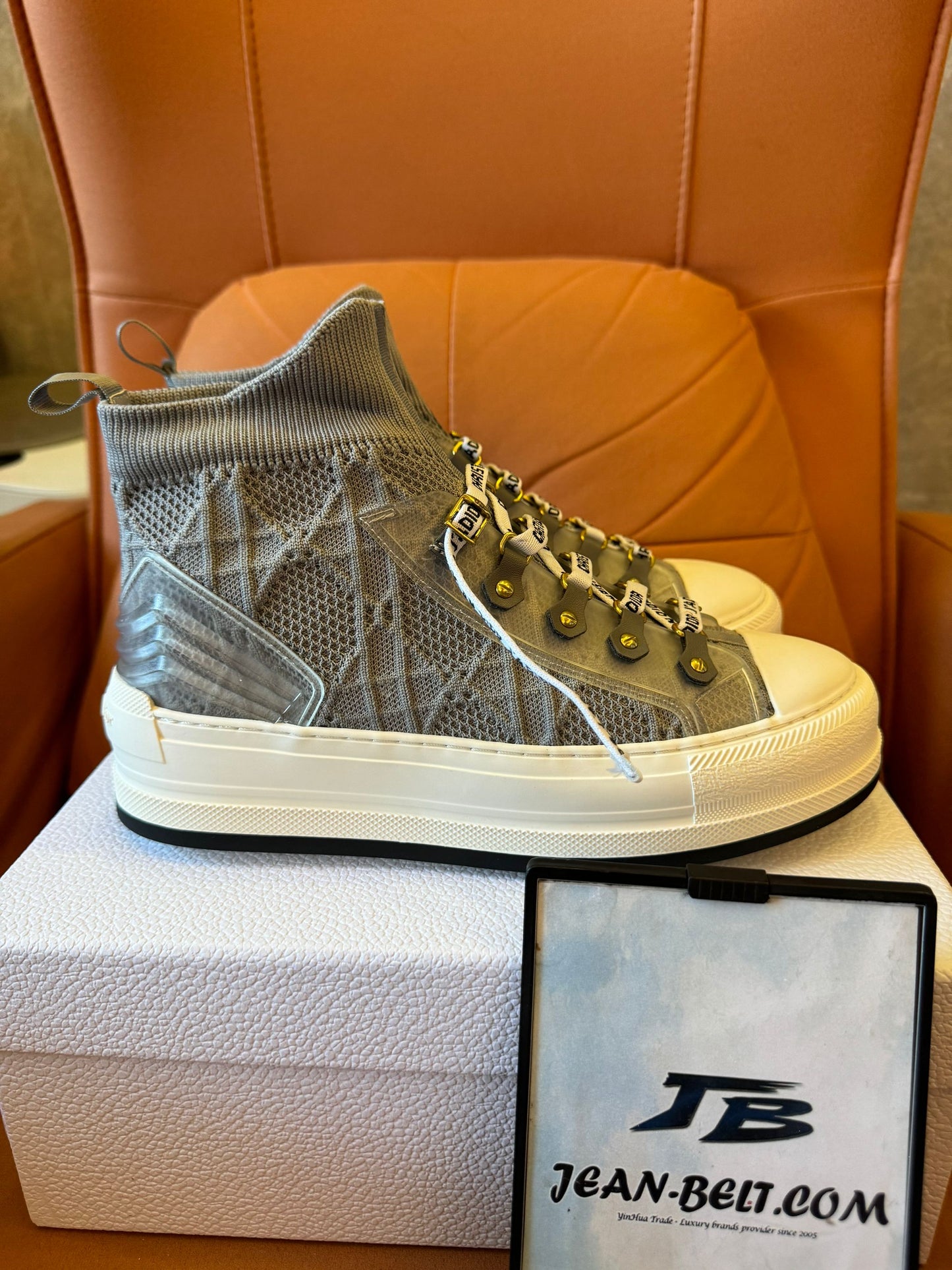 Christian Dior high-top mesh sneakers with signature monogram detailing