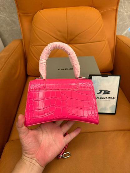 Balenciaga hourglass top handle bag in crocodile embossed pink leather