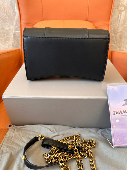 Balenciaga B clutch bag with gold chain strap