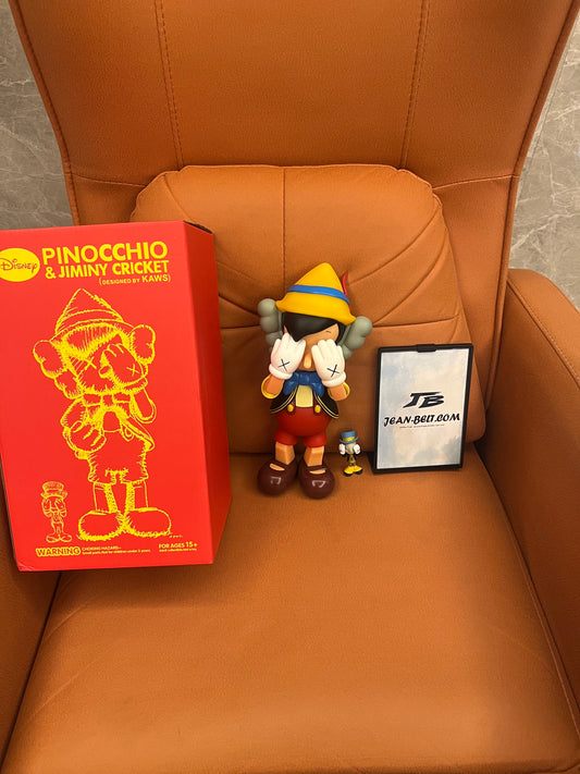 KAWS pinocchio and jiminy cricket vinyl figures - limited edition