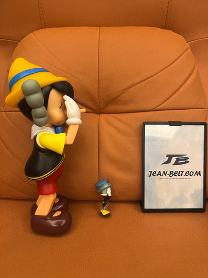 KAWS pinocchio and jiminy cricket vinyl figures - limited edition