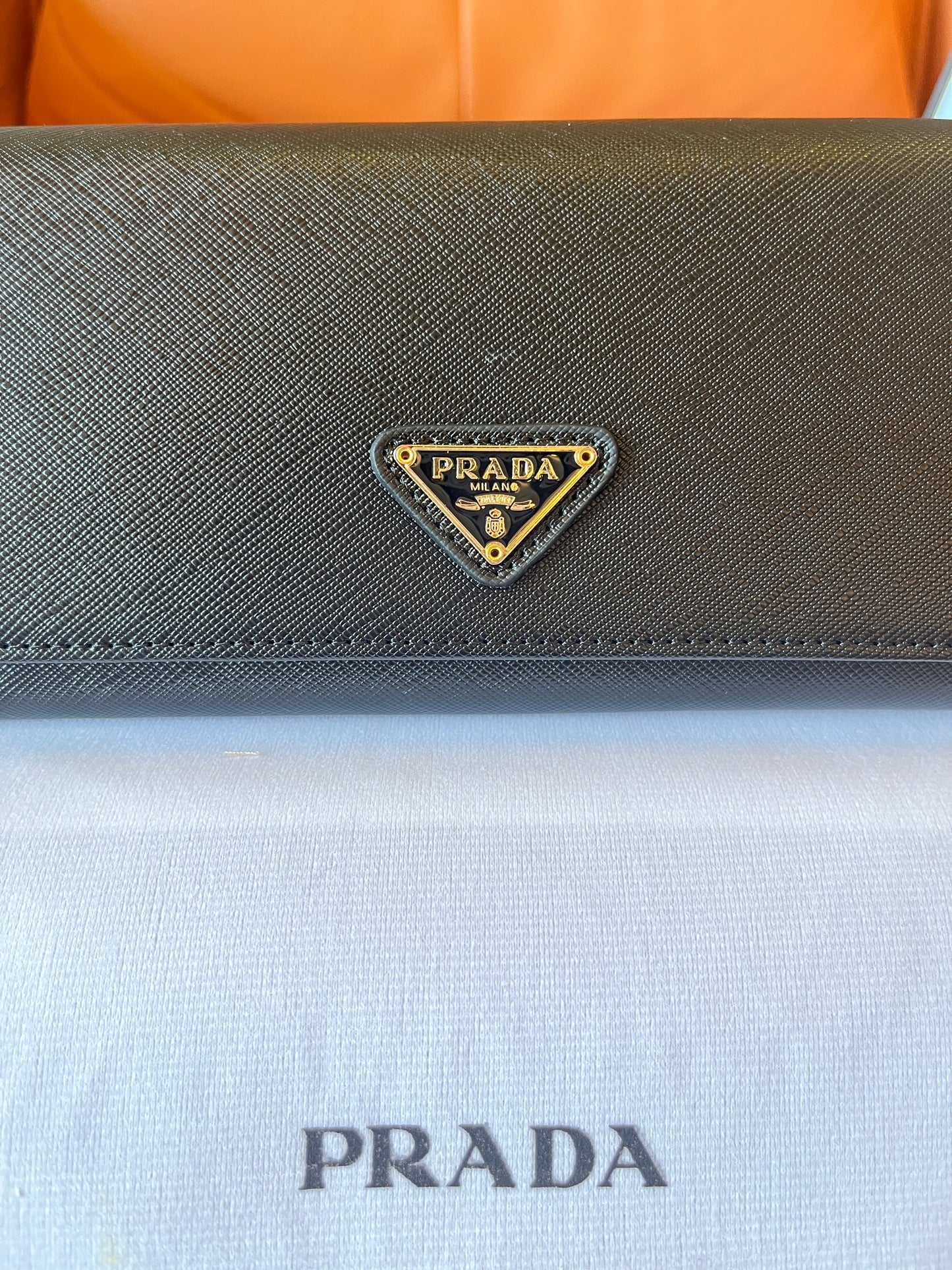 Prada silver logo plaque fold continental wallet