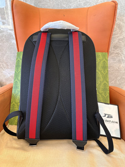 Gucci GG Supreme backpack with red and blue straps