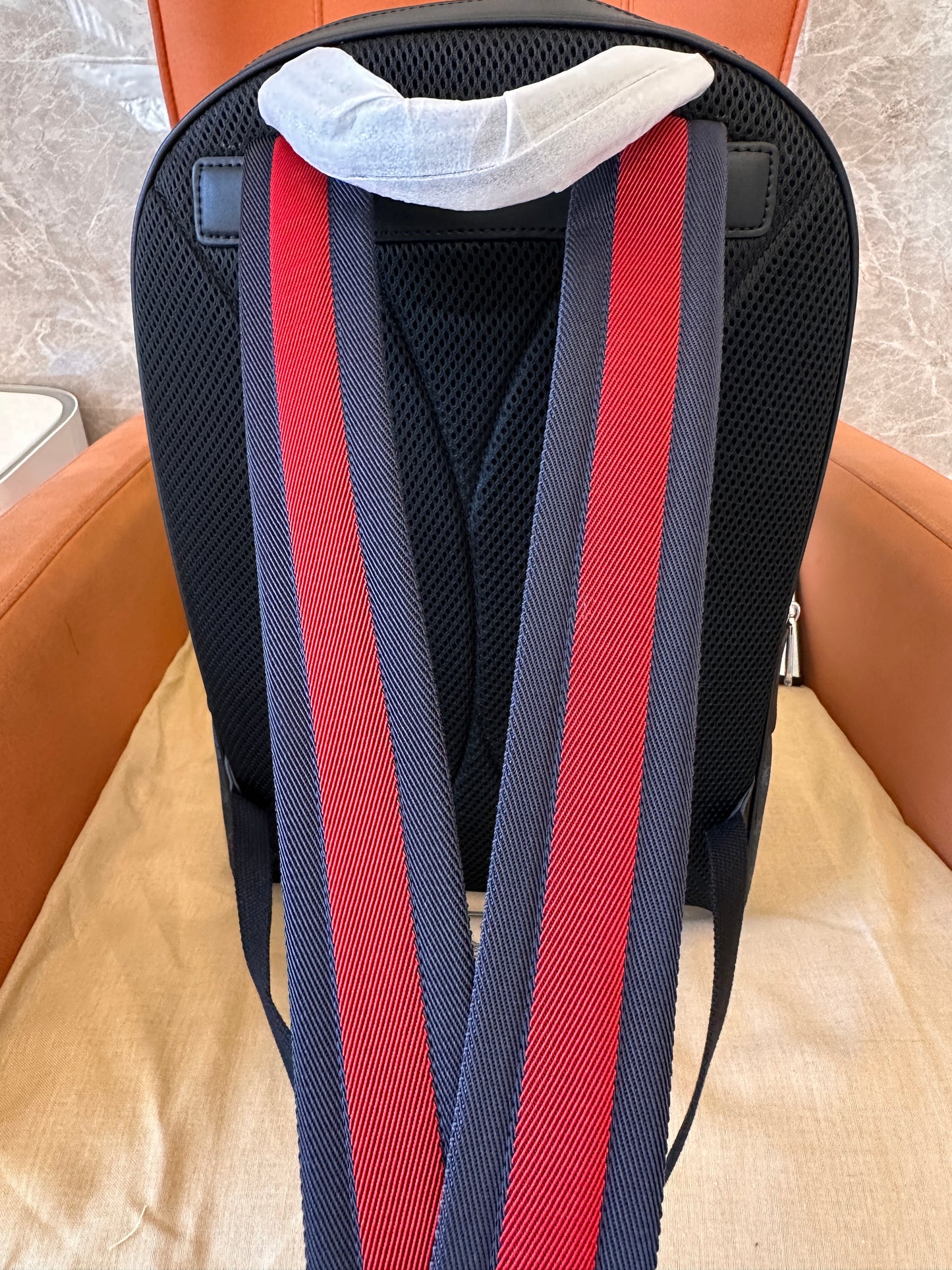 Gucci GG Supreme backpack with red and blue straps