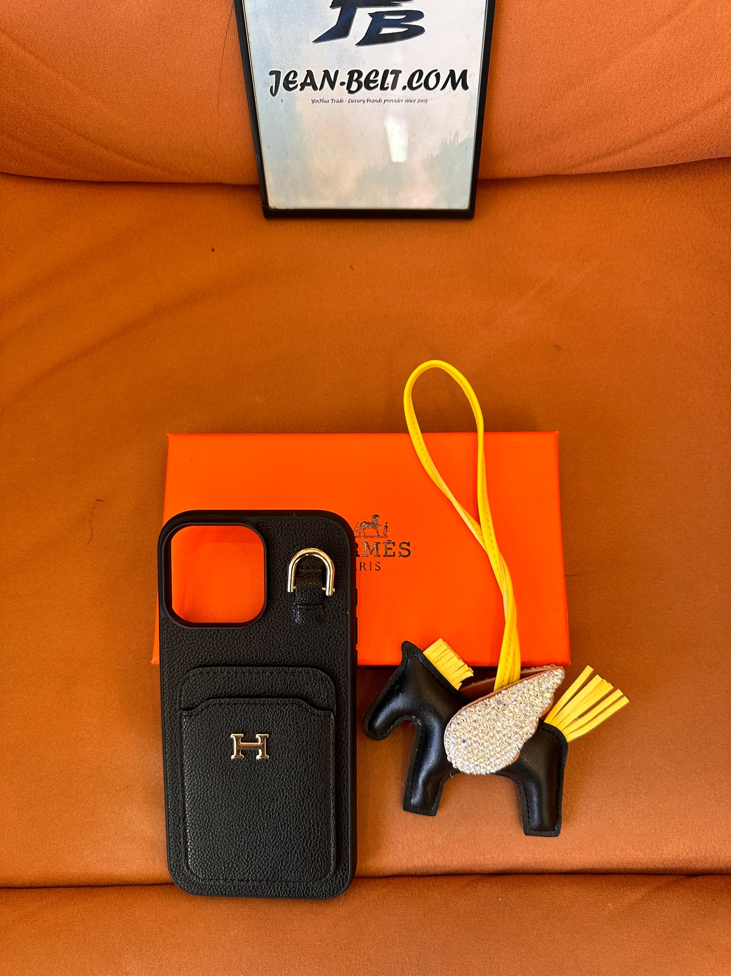 Hermès leather phone case with pouch, and pegasus charm