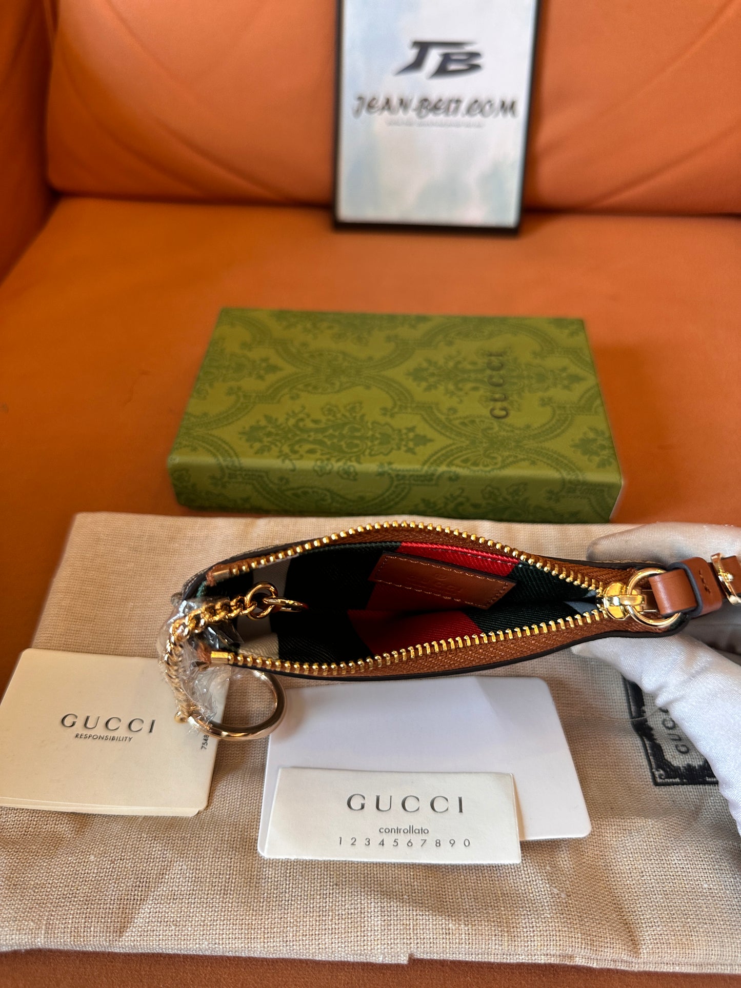 Gucci GG supreme monogram key pouch with zip closure