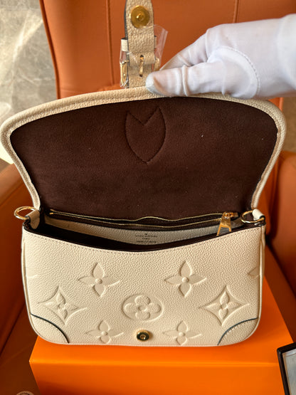 Louis Vuitton monogram Empreinte leather pochette bag