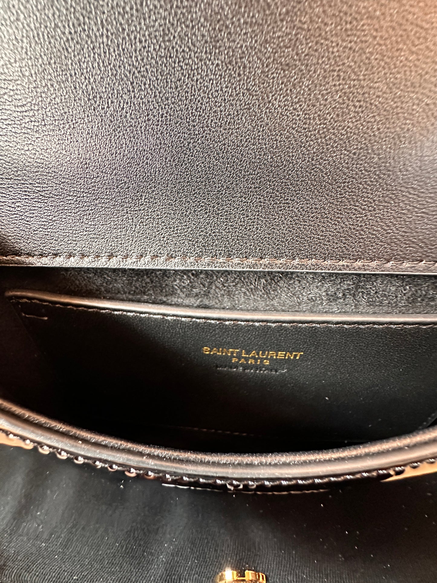 Saint Laurent Le 5 à 7 Hobo bag in black patent leather with gold YSL logo