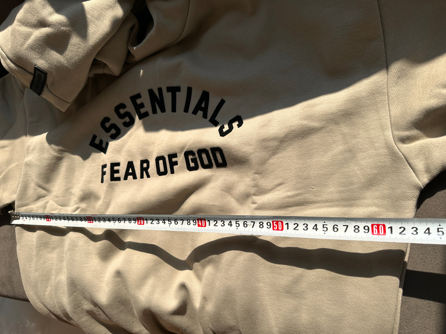 Fear of God Essentials oversized hoodie in taupe