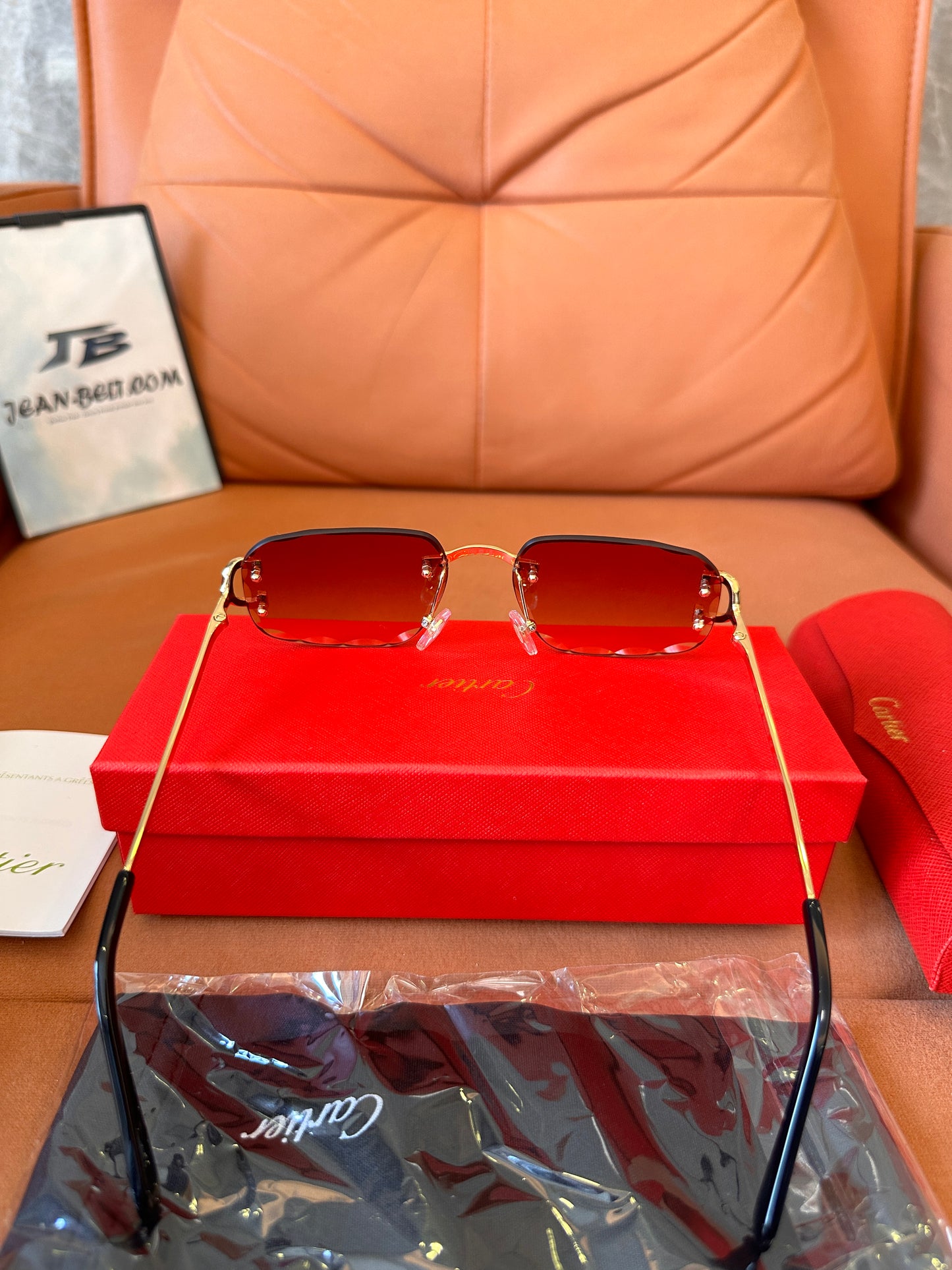 Cartier rimless red-tint sunglasses