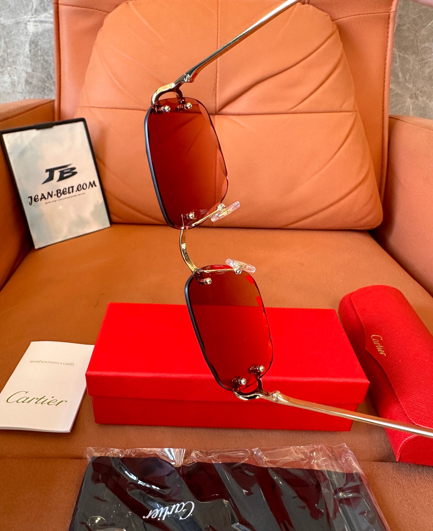 Cartier rimless red-tint sunglasses