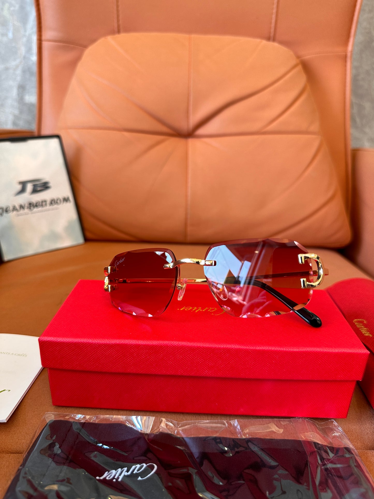 Cartier rimless red-tint sunglasses