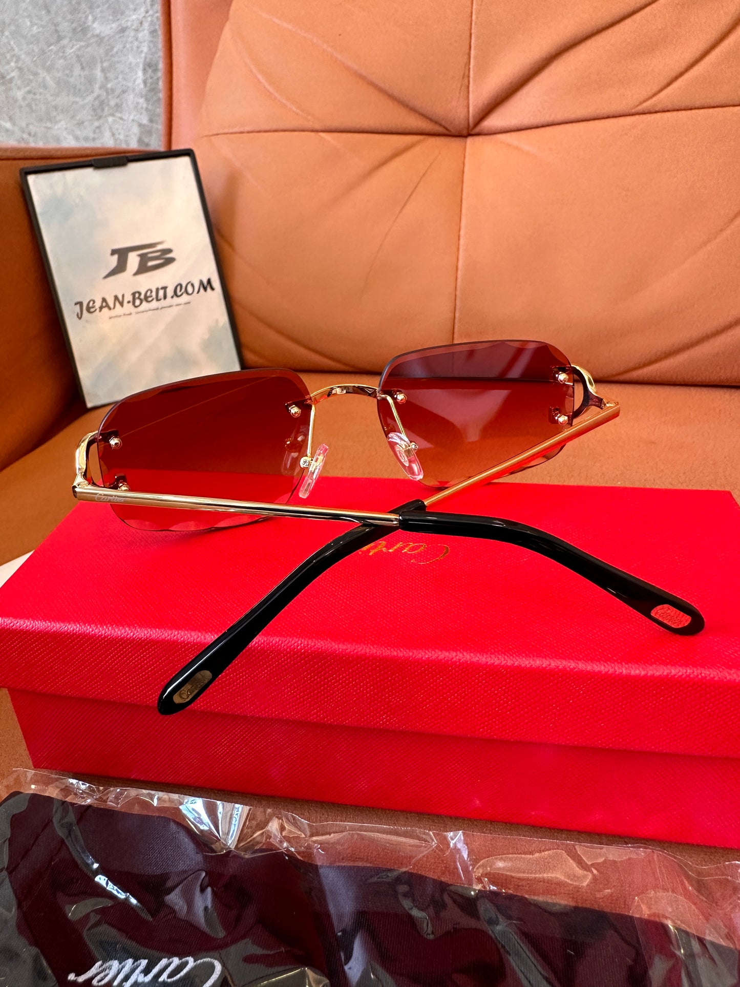 Cartier rimless red-tint sunglasses