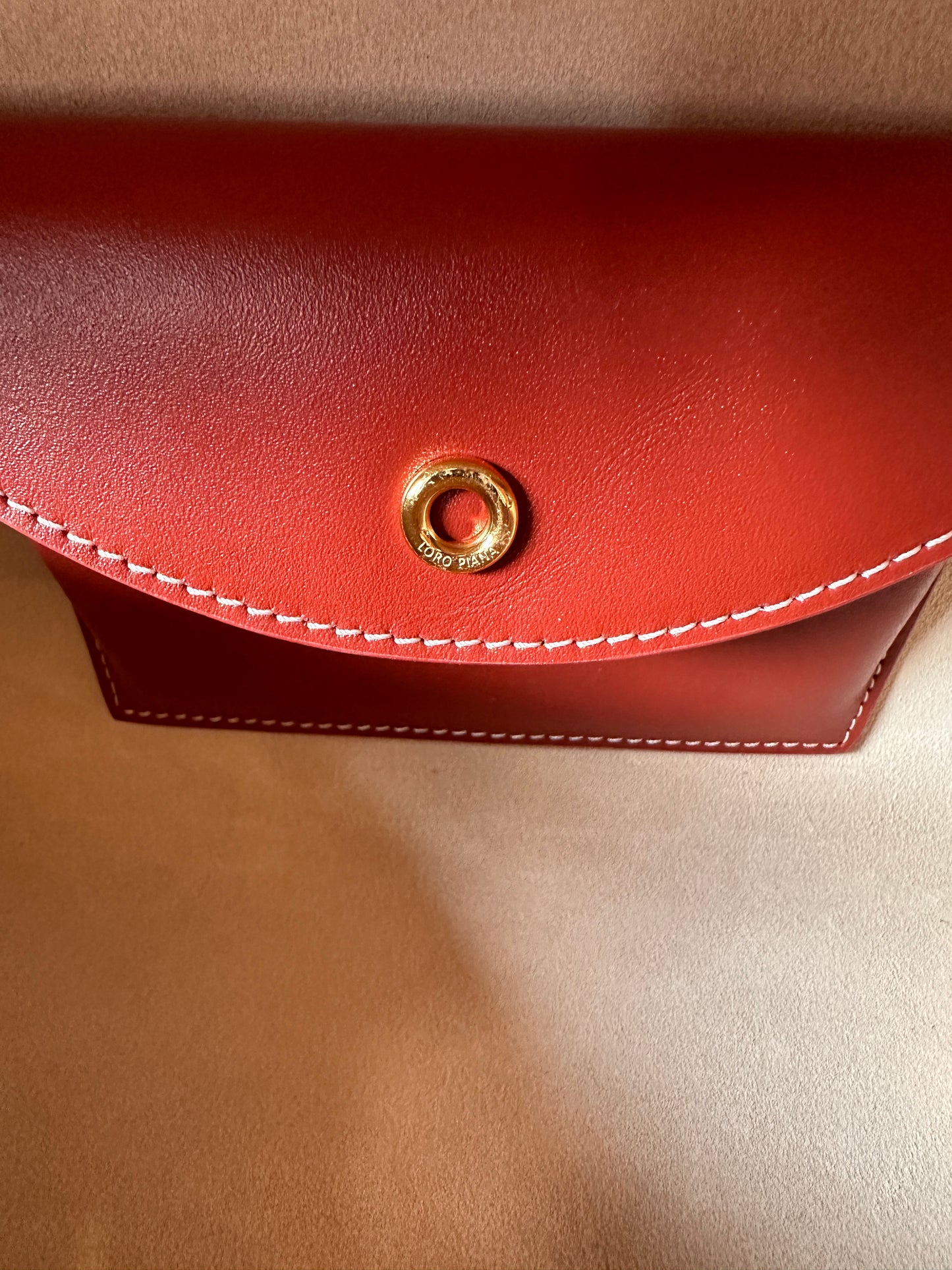 Loro Piana red-brown leather crossbody bag with dual zipper