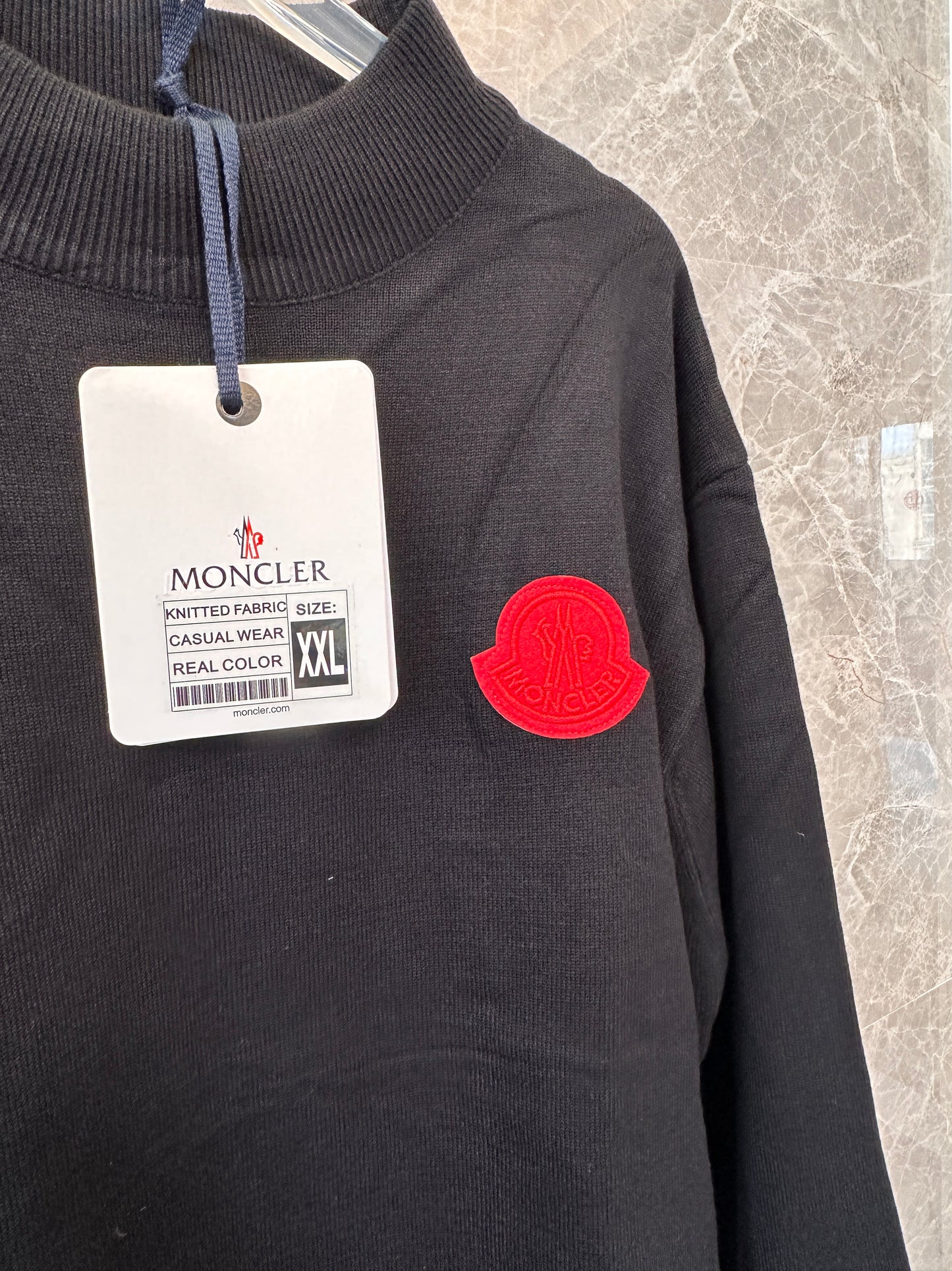 Moncler men's black knit sweater with red logo patch