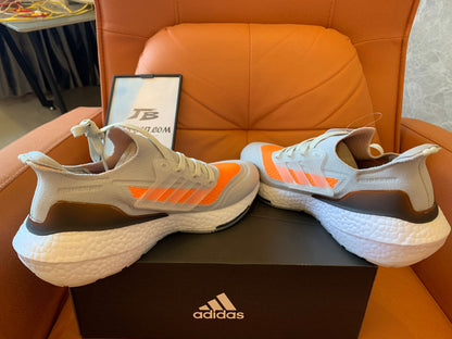 Adidas Ultraboost 22 - light gray with orange accents